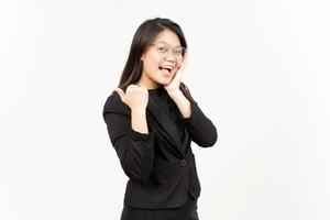 Presenting and Pointing Side Product Using Thumb Of Beautiful Asian Woman Wearing Black Blazer photo