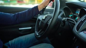 Man driving in innovative automated car using self-parking autopilot for parking on street video