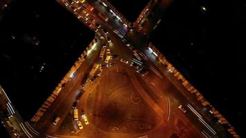Hyperlapse of night city traffic on stop street intersection circle roundabout. Aerial view. video