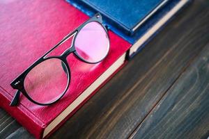 Close up Eye glasses and books photo