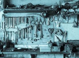 Old tool shelf against a wall photo