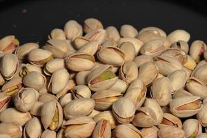 Pistachios texture and background . Tasty pistachios as background,as pistachios texture photo