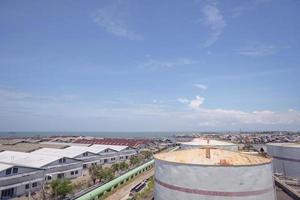 Arial view of power plant project with blue sky and cloudy vibes. The photo is suitable to use for industry background photography, power plant poster and electricity content media.