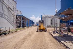 Land scraper and Vibro roller the heavy equipment for pretreatment road construction. The photo is suitable to use for industry background photography, power plant poster and electricity