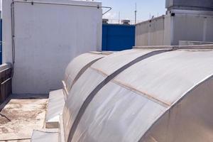 Landscape photo of roof top power plant building with blue sky. The photo is suitable to use for industry background photography, power plant poster and electricity content media.