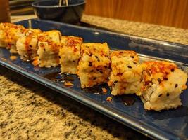 Close up sushi tamago mayonnaise with toping cheese cedar. The photo is suitable to use for Japan traditional food background, poster and food content media.