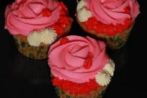 A Pink Cupcake isolated on a texture background photo