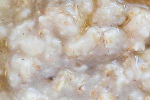 close up of oatmeal porridge with honey photo