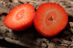 Fresh strawberry half slice in close up view photo