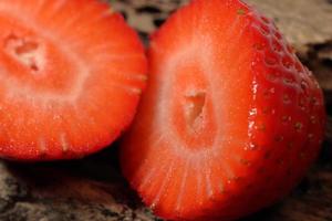 Fresh strawberry half slice in close up view photo