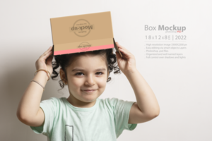 Little girl holding an empty gift box at top of her head psd