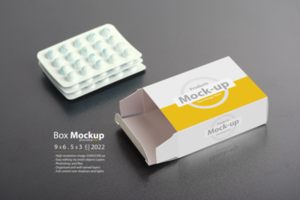 Opened pillbox with loafs of tablets on dark background psd