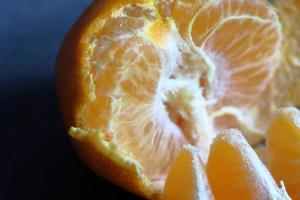 Orange peeled skin on a texture background photo