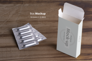 Suppositories loafs and an empty box on wooden table background psd