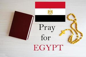 Pray for Egypt. Rosary and Holy Bible background. photo