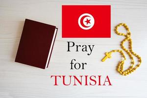 Pray for Tunisia. Rosary and Holy Bible background. photo