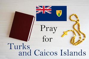 Pray for Turks and Caicos Islands. Rosary and Holy Bible background. photo