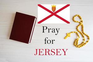 Pray for Jersey. Rosary and Holy Bible background. photo