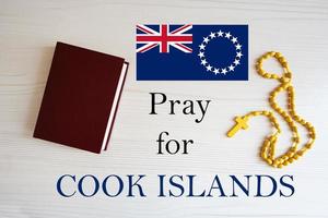 Pray for Cook Islands. Rosary and Holy Bible background. photo