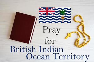 Pray for British Indian Ocean Territory. Rosary and Holy Bible background. photo