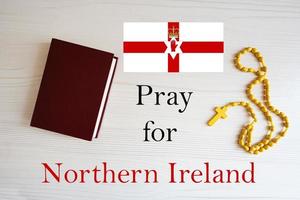 Pray for Northern Ireland. Rosary and Holy Bible background. photo