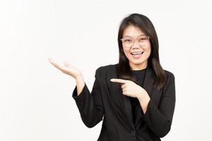 Showing and Presenting Product on Open Palm Of Beautiful Asian Woman Wearing Black Blazer photo