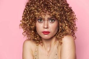 Model Surprised look red lips curly hair close-up bright makeup photo