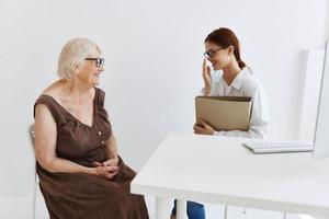 doctors in the medical office conversation with the patient professional treatment photo