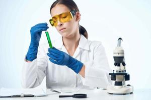 woman laboratory assistant research microscope diagnostics science photo