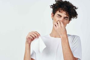 man in white t-shirt handkerchief cold treatment photo