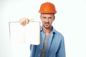 man in orange helmet protection isolated background photo