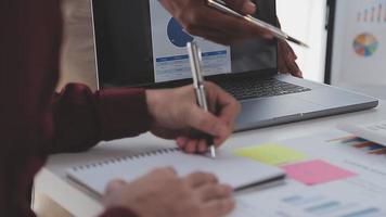 Financial analysts analyze business financial reports on a digital tablet planning investment project during a discussion at a meeting of corporate showing the results of their successful teamwork. video