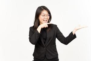 Showing and Presenting Product on Open Palm Of Beautiful Asian Woman Wearing Black Blazer photo