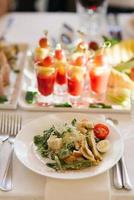 Caesar salad and snacks in glass in the serving of a festive banquet at a wedding photo