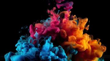 Rainbow of colors. Colors explosion. Ink in water isolated on black background. . photo