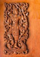 pattern of traditional thai style carved on wood background photo