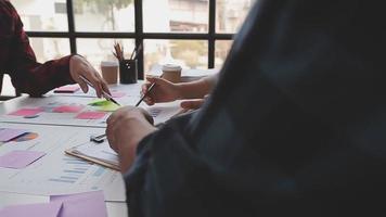 Financial analysts analyze business financial reports on a digital tablet planning investment project during a discussion at a meeting of corporate showing the results of their successful teamwork. video