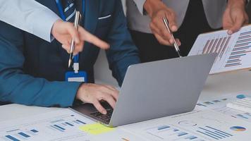 Financial analysts analyze business financial reports on a digital tablet planning investment project during a discussion at a meeting of corporate showing the results of their successful teamwork. video