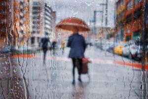 Bilbao, Vizcaya, Spain, 2023 - people with an umbrella in rainy days in winter season, bilbao, photo