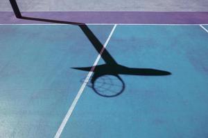 basketball hoop shadow on the basketball court photo