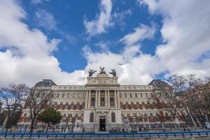 Various photos of madrid streets with colorful buildings and sky