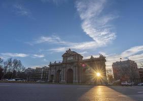 The Alcala Gate is a neoclassical monument located in the Plaza de la Independencia square in Madrid, the capital of Spain. photo