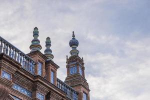 Plaza de Espana is a square located in Seville, Spain and was built for the Iberian-American Expo, and it has an important place in Spanish architecture photo