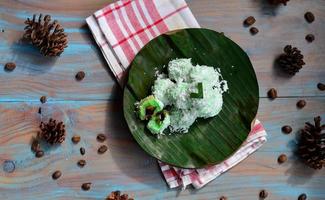 Klepon or kelepon is one of Indonesia's traditional cakes made from glutinous rice flour which is shaped like small balls and filled with brown sugar and then boiled photo