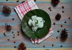 Klepon or kelepon is one of Indonesia's traditional cakes made from glutinous rice flour which is shaped like small balls and filled with brown sugar and then boiled photo