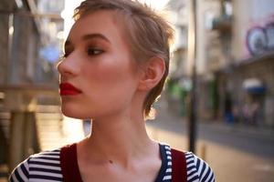 pretty woman from short hair outdoors walk close-up photo