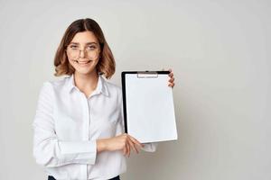 Business woman in white shirt with documents in hands emotion work success photo