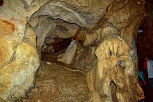 interesting original cave in the Turkish mountains with stalactites and stalagmites creating the background photo