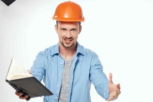 man in construction uniform blueprints builder isolated background photo