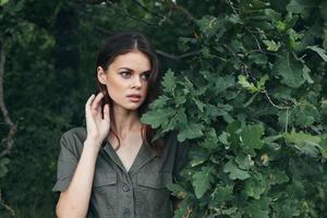 Portrait of a woman Fresh air looks to the side of green bushes travel photo